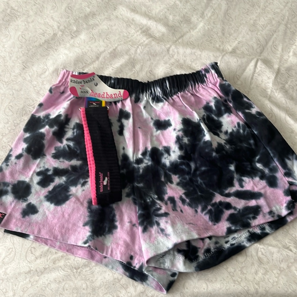 A small tie-dye short. Brand is on the bands, black and pink
